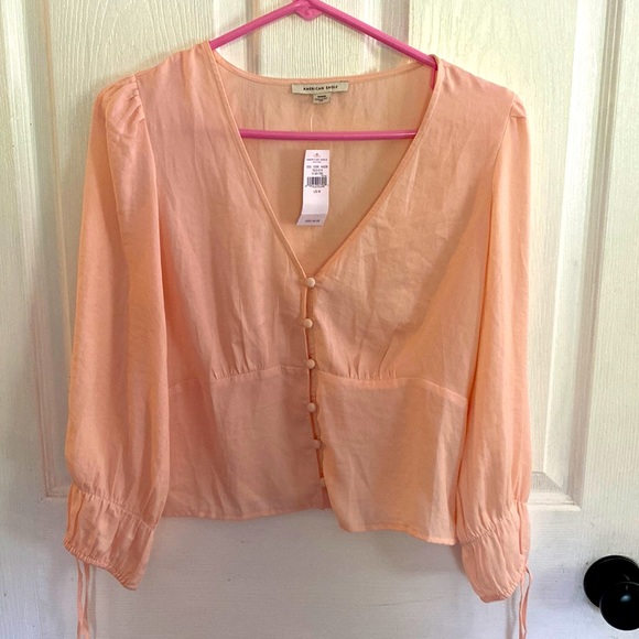 American Eagle Outfitters Tops - Pink/peach top from American Eagle. Brand new with tags.